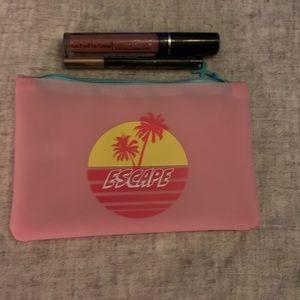 Makeup bag with lipgloss and eyeliner